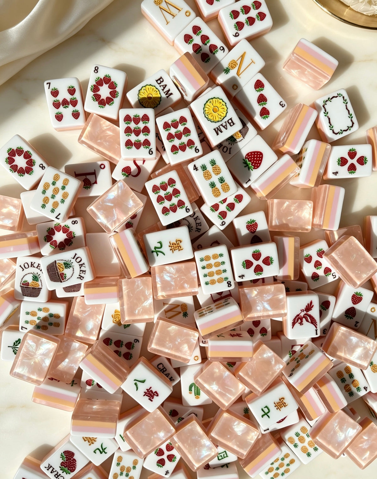 MAHORA Fruity Sparkle: Overhead arrangement of fruit-themed faces and peach backs