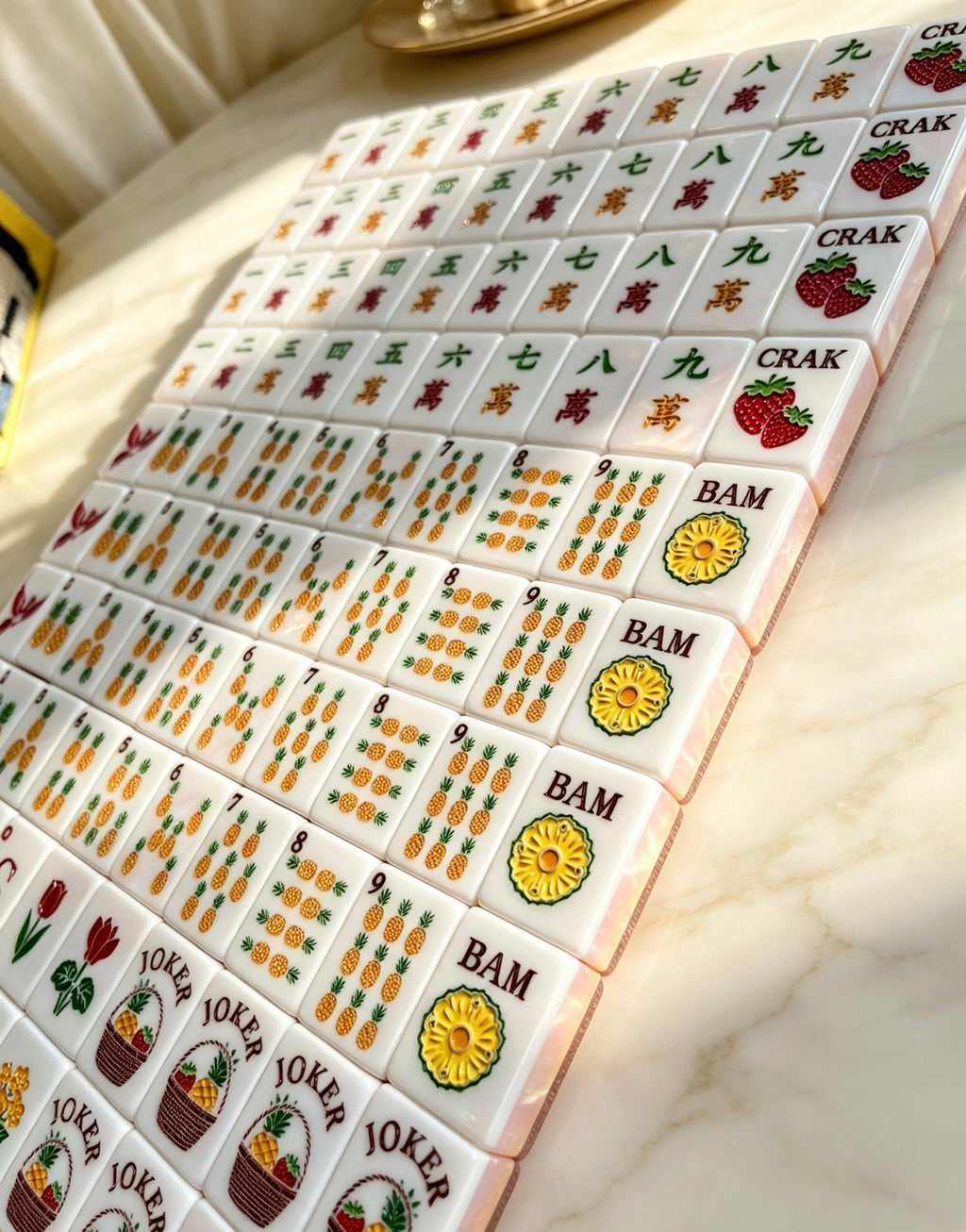 MAHORA Fruity Sparkle: Angled view of fruit-inspired numbered suit designs
