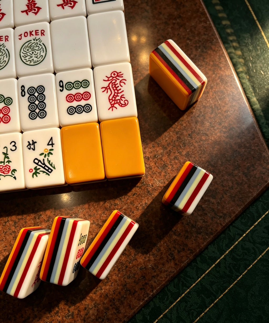 MAHORA 7-Layer: Joker, dot and flower tiles beside orange backs
