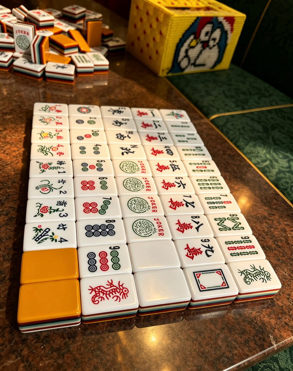 MAHORA 7-Layer: Arranged traditional tile faces on a dark tabletop