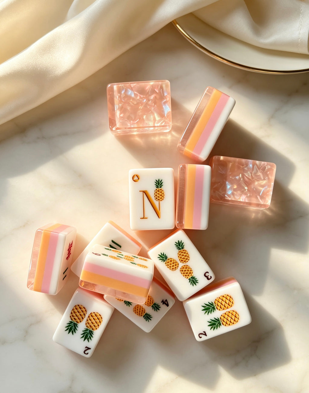 MAHORA Fruity Sparkle: Wind letters and pineapple design beside peach tile backs