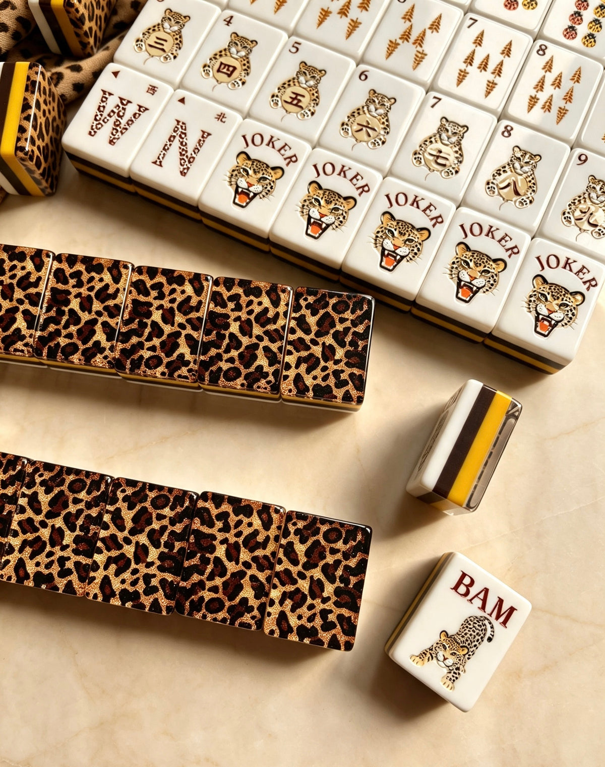 MAHORA Leopard Print: Leopard tile backs beside wind and joker faces