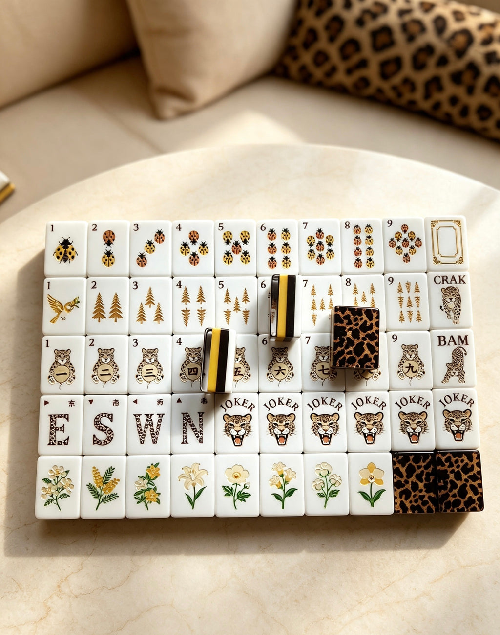 MAHORA Leopard Print: Mixed tile designs arranged on a cream table