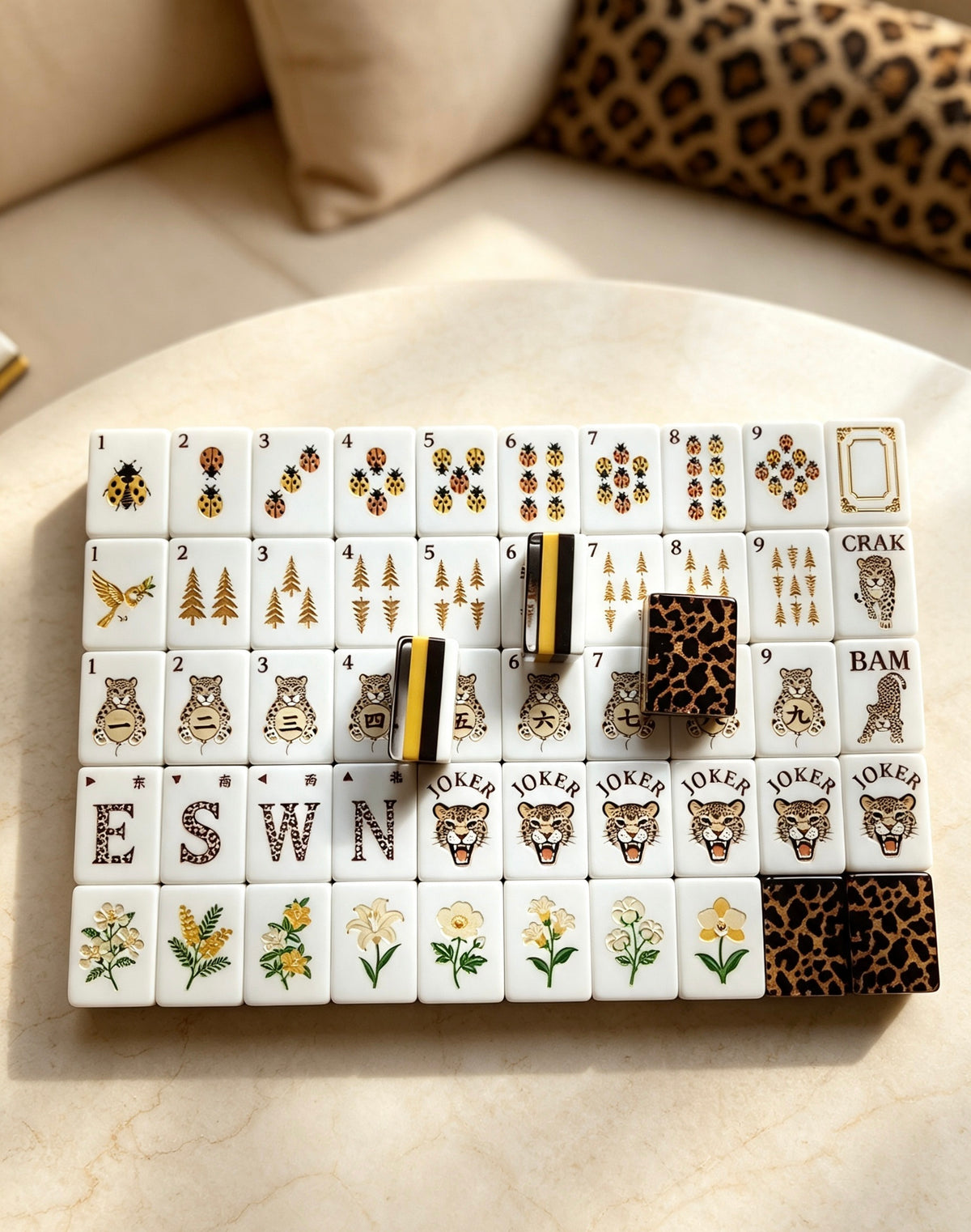 MAHORA Leopard Print: Mixed tile designs arranged on a cream table