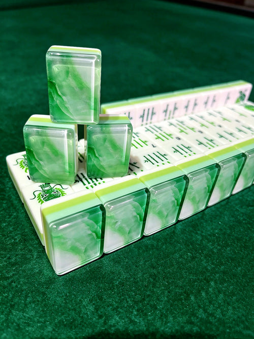 MAHORA Emerald: Stacked green tiles showing layered sides and marbled backs